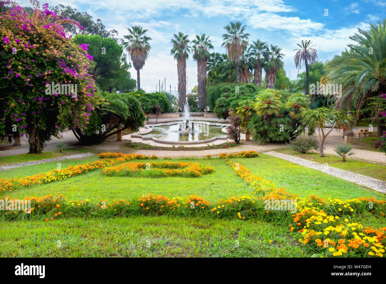 View of floral colorful lawn and fountain in the Alfredo Nobel park in San Remo. Liguria, Italy Stock Photo