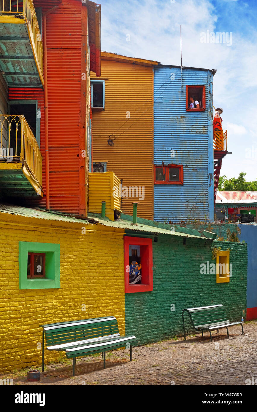 Vertical view of colorful buildings in Caminito of the Argentinean district La Boca, in Buenos Aires, with vintage walls against a blue sky. Stock Photo