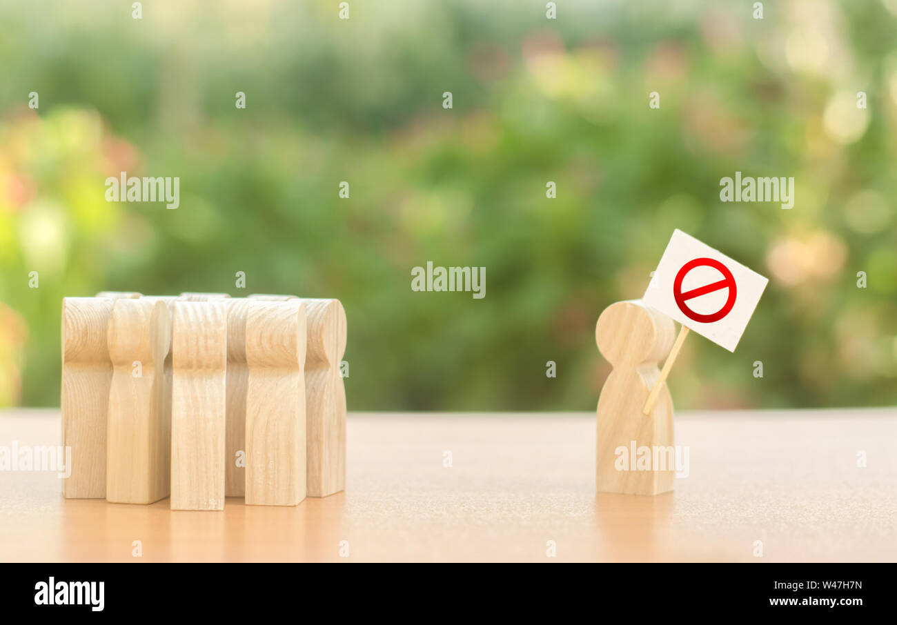 A person with a poster protests and draws public attention to the