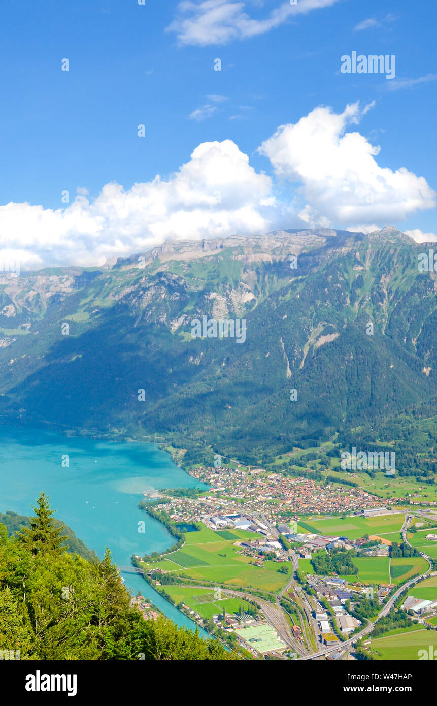 Turquoise Lake Brienz in Interlaken, Switzerland from above from Harder Kulm. Beautiful Swiss landscapes. Green hills, Swiss Alps. Summer Alpine landscapes. Amazing view. Stock Photo