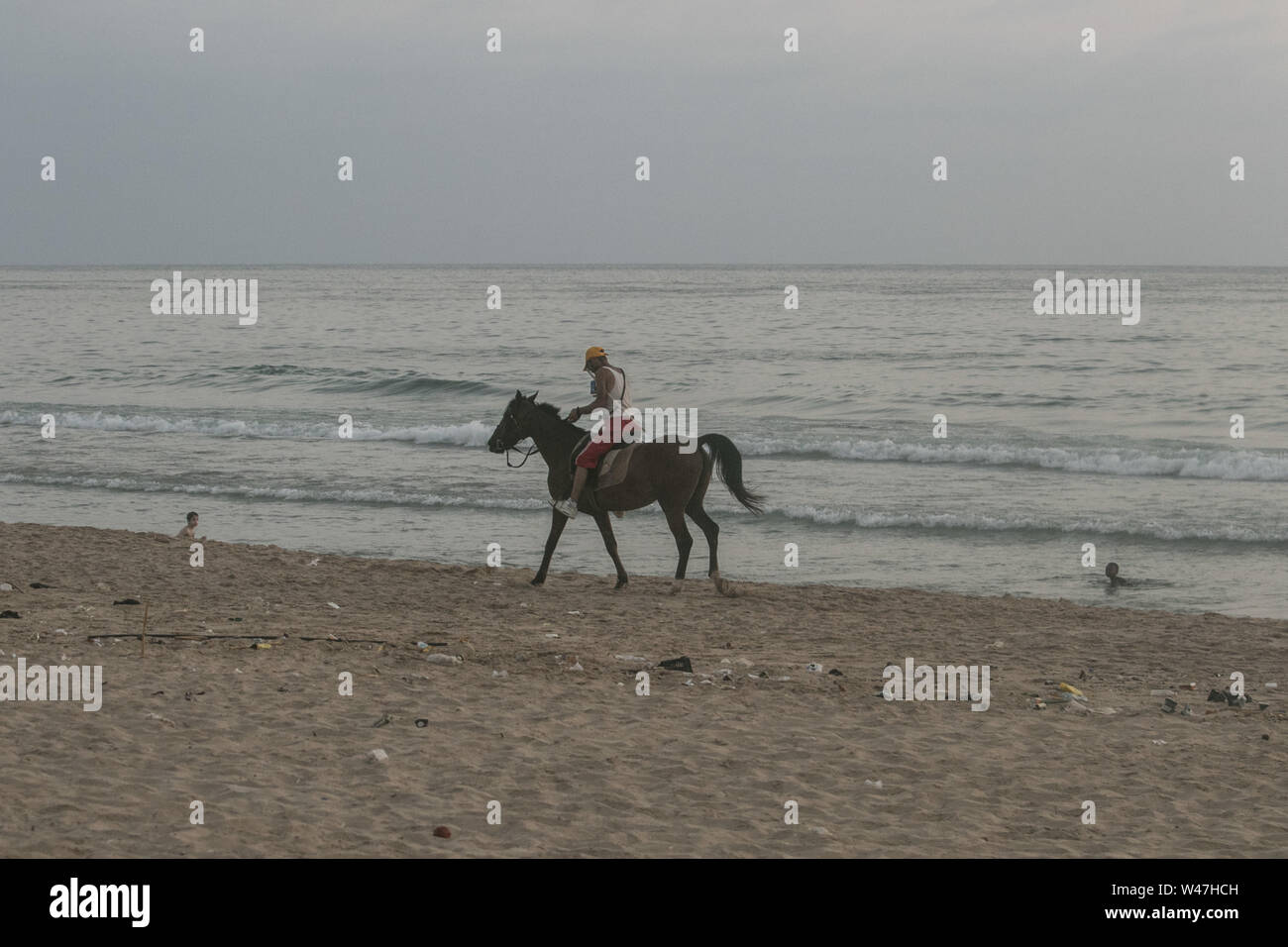 Beirut, Lebanon. 20th July, 2019. A man rides a horse at the beach as the sun sets in Beirut. Credit: Amer Ghazzal/SOPA Images/ZUMA Wire/Alamy Live News Stock Photo