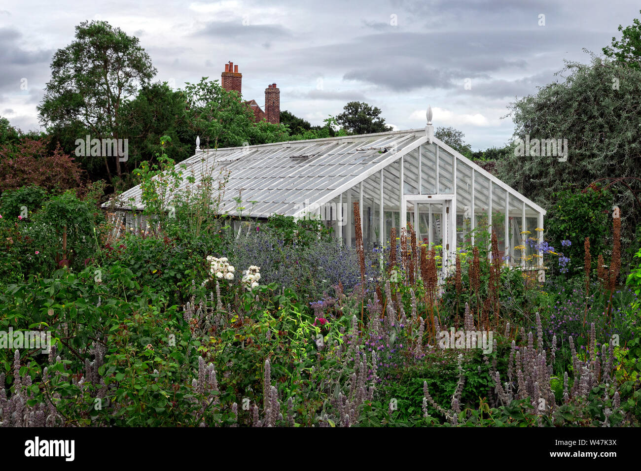 Wooden greenhouse in English country house garden Kent UK Stock Photo