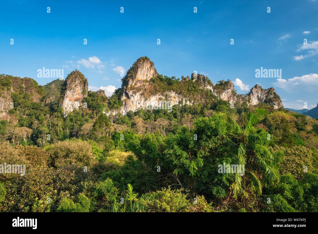 Beautiful tropical landscape with huge limestone cliffs surrounded by jungle forest at Khao Sok National Park, Thailand Stock Photo