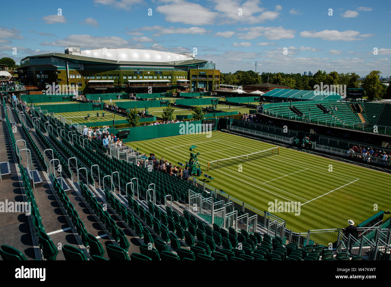 General View of Centre Court and Court 12 at The Wimbledon Championships 2019. Held at The All England Lawn Tennis Club, Wimbledon. Stock Photo