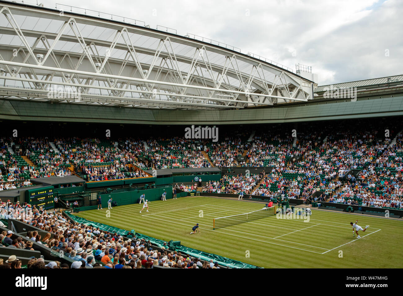 General View of Kyle Edmund and Jaume Munar on Centre Court at The Wimbledon Championships 2019. Held at The All England Lawn Tennis Club, Wimbledon. Stock Photo