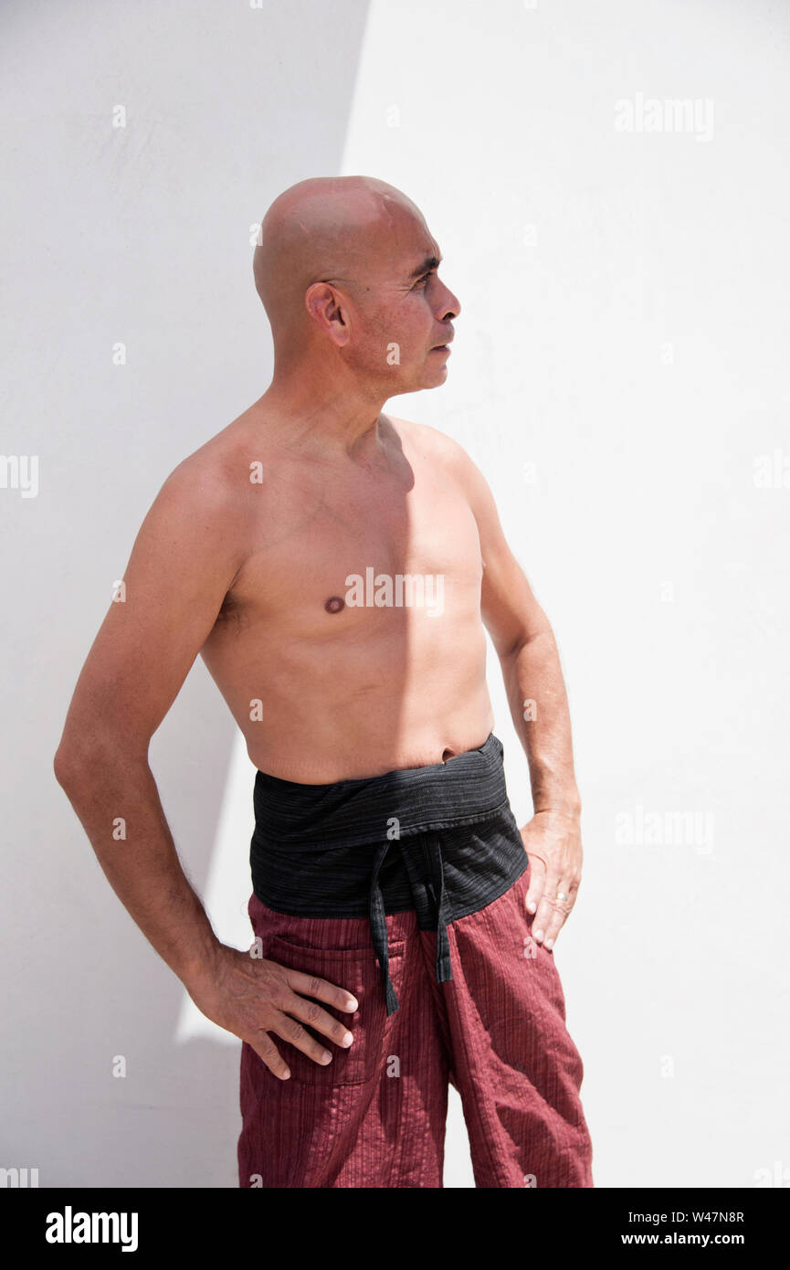 Martial Arts man practicing mindfulness exercises to harmonize body