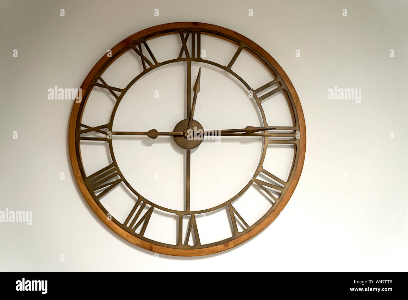 Modern metal and wood wall watch Stock Photo Alamy