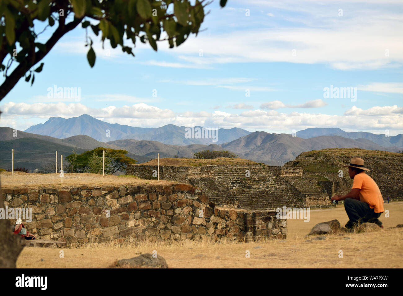Mexican mad sitting in front of an archaeological structure in the City of Teotihuacan, Mexico. Stock Photo