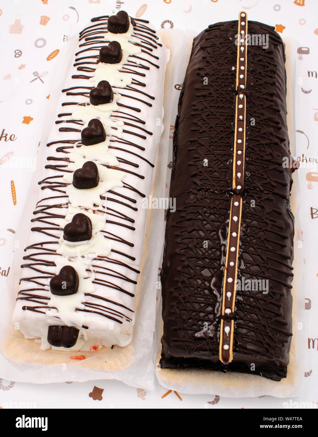 Gypsy arm cake with chocolate cream and chocolate decoration with milk