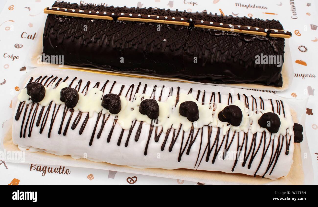 Gypsy arm cake with chocolate cream and chocolate decoration with milk