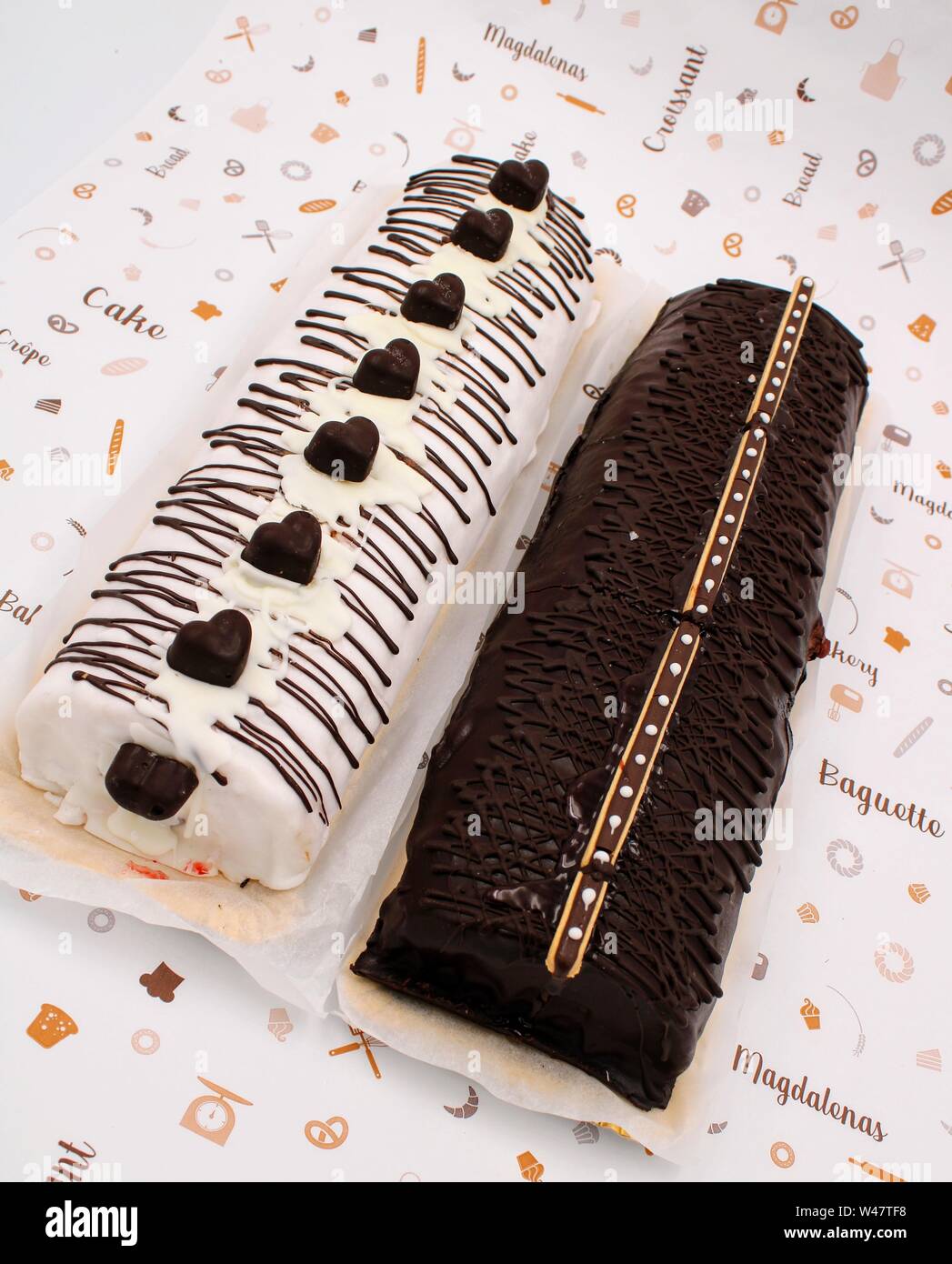 Gypsy arm cake with chocolate cream and chocolate decoration with milk