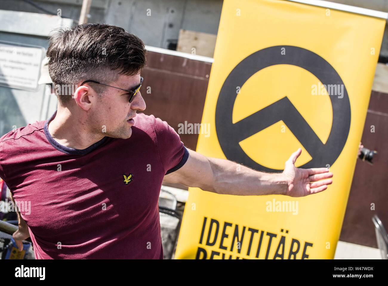 Halle Saale, Sachsen Anhalt, Germany. 20th July, 2019. MARTIN SELLNER, head of the Identitaere Bewegung (Identitaeren Movement). Sellner is a prominent figure of the alt right and international white supremacist movements. He is currently banned from traveling to the United States and has a permanent ban from entering the United Kingdom. Amid protests, the white supremacist, right extremist Identitaere Bewegung (Generation Identity, Identitaren Movement) held a rally in Halle (Saale). The Identitaere have recently faced numerous challenges, including raids to explore the connection of its h Stock Photo