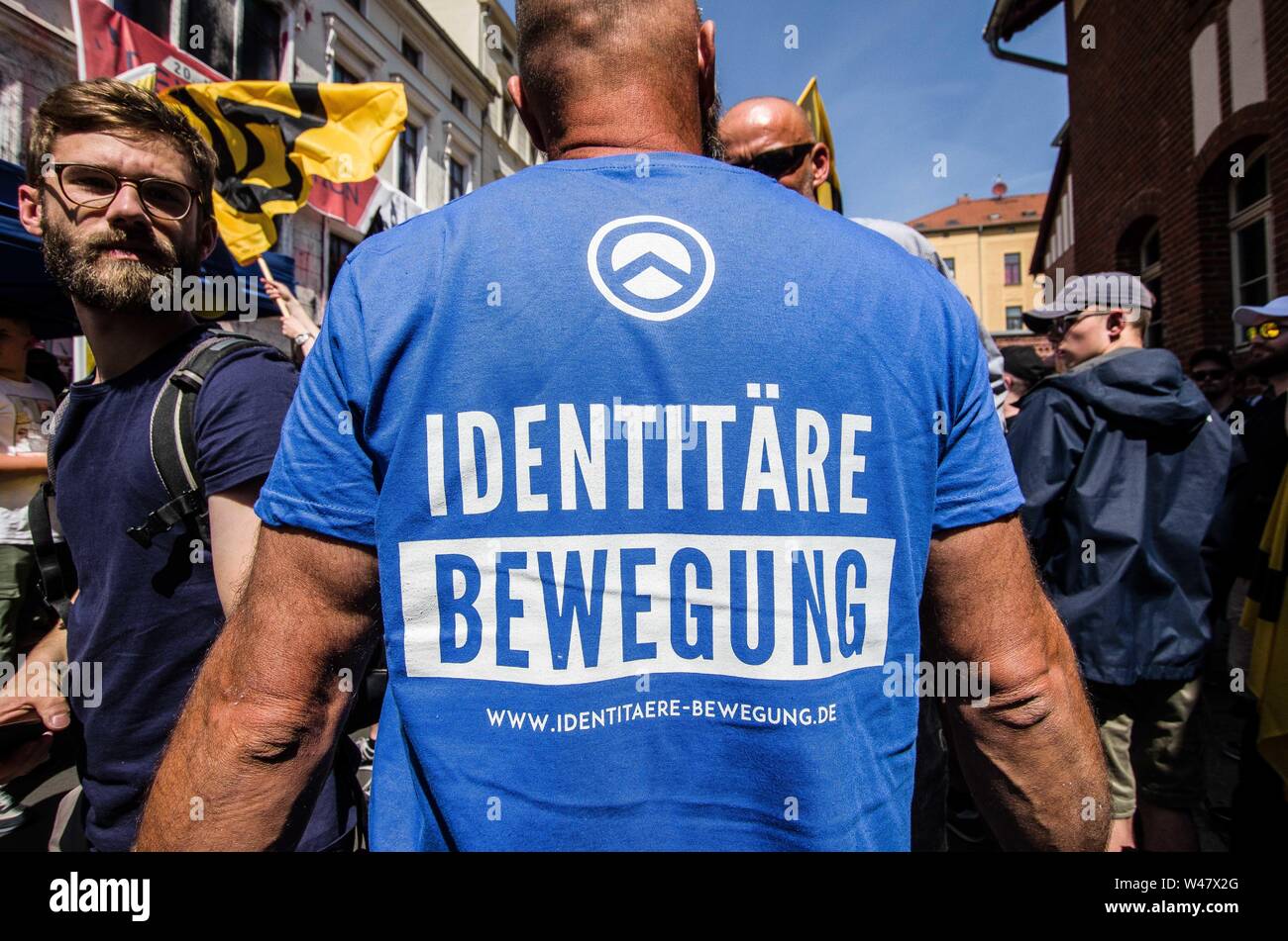 Halle Saale, Sachsen Anhalt, Germany. 20th July, 2019. Amid protests, the white supremacist, right extremist Identitaere Bewegung (Generation Identity, Identitaren Movement) held a rally in Halle (Saale). The Identitaere have recently faced numerous challenges, including raids to explore the connection of its head Martin Sellner to the Christ Church shooter, as well as in Germany where the IB was officially classified as 'right-extremist''. The group has renewed the use of the 'blood and soil'' (Blut und Boden) theories and espouses a 'great replacement'' of white people, which was Stock Photo