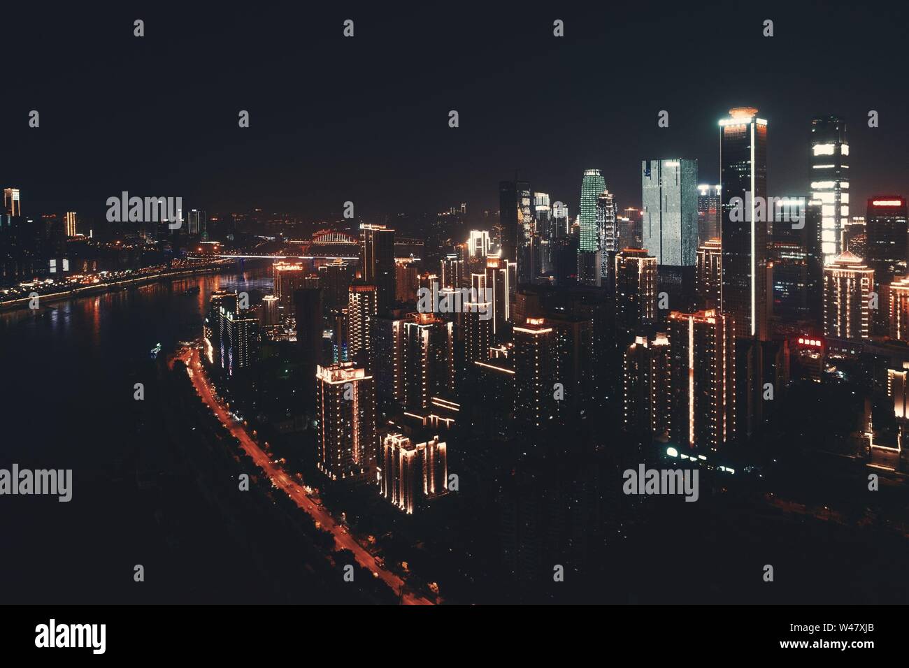 Aerial view of urban buildings and city skyline at night in Chongqing ...