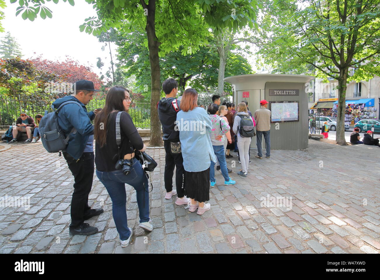 People queue for public toilet in Paris France Stock Photo Alamy