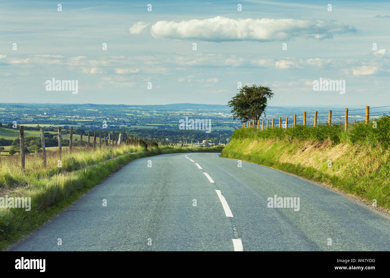 Scenic empty asphalt road across farming fields in rural Shropshire, UK Stock Photo
