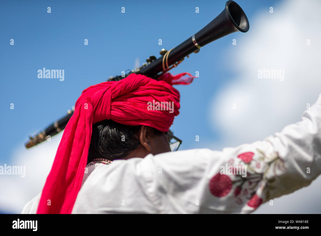 Indian musician performing, with a clarinet on his head, Rajasthan Heritage Brass Band, UK Stock Photo