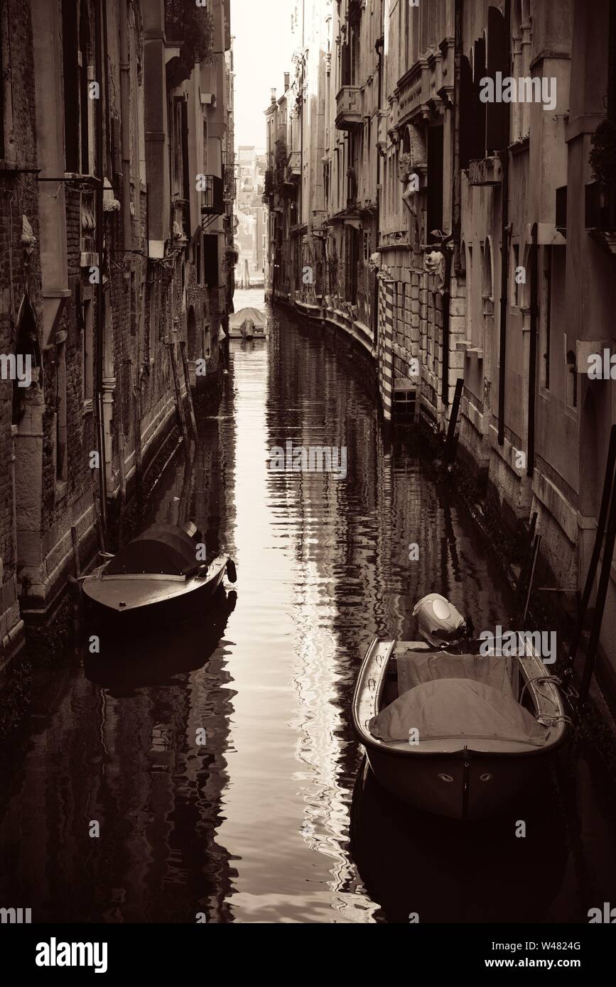 Boat park in Venice alley canal. Italy Stock Photo - Alamy