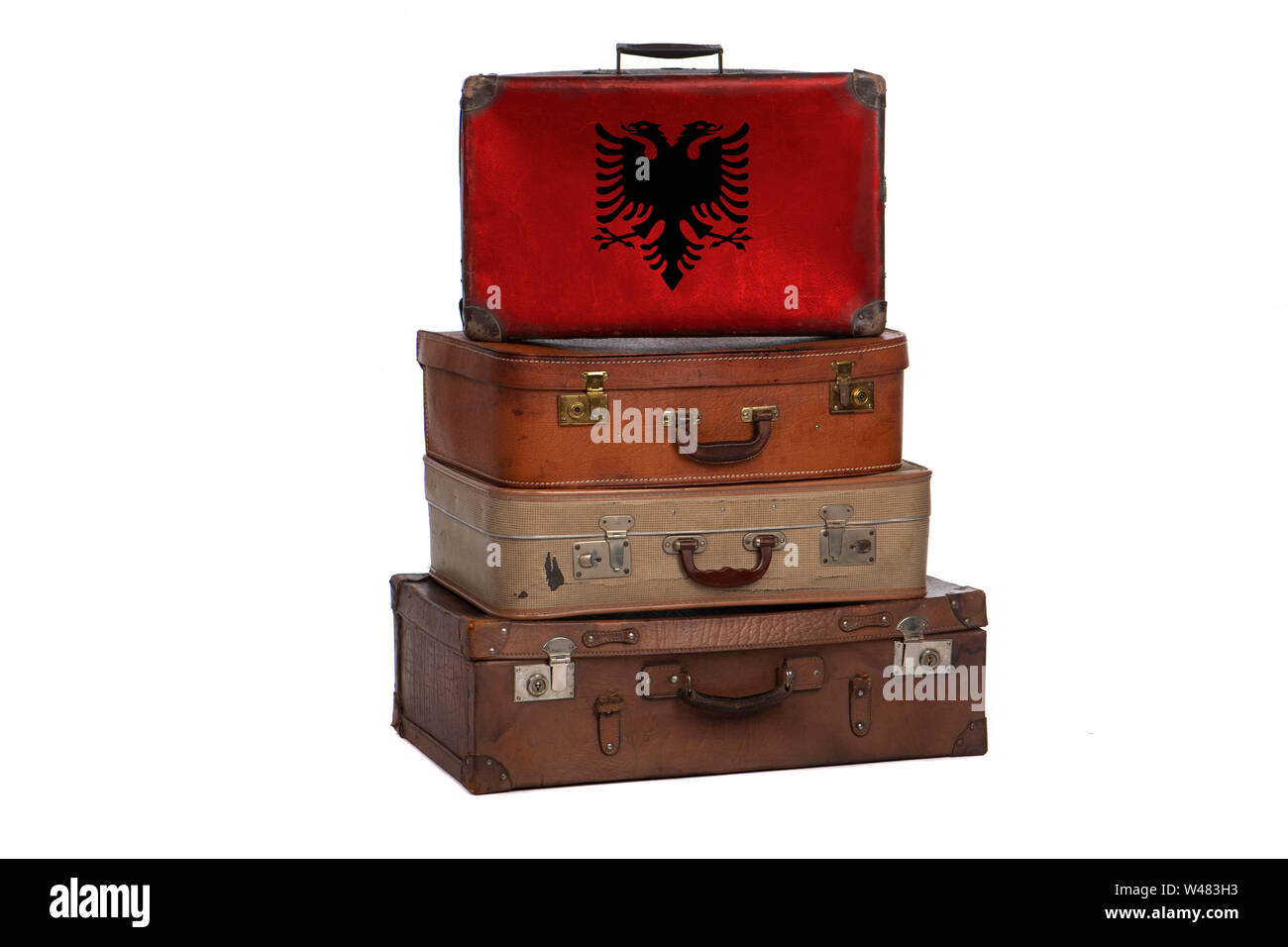 Albania, Albanian travel concept. Group of vintage suitcases isolated on white background Stock Photo