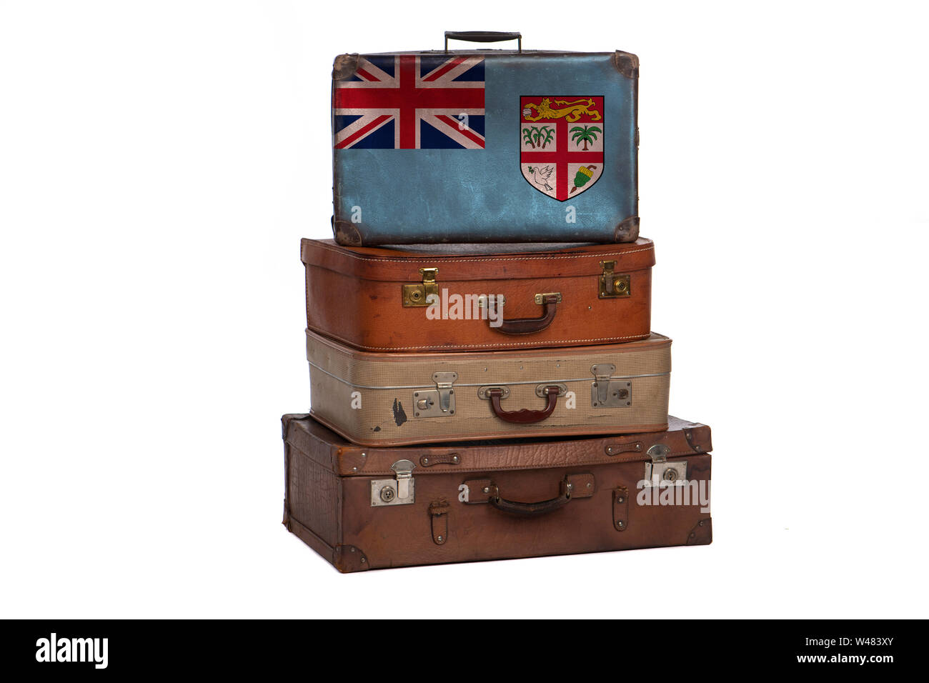 Fiji travel concept. Group of vintage suitcases isolated on white background Stock Photo