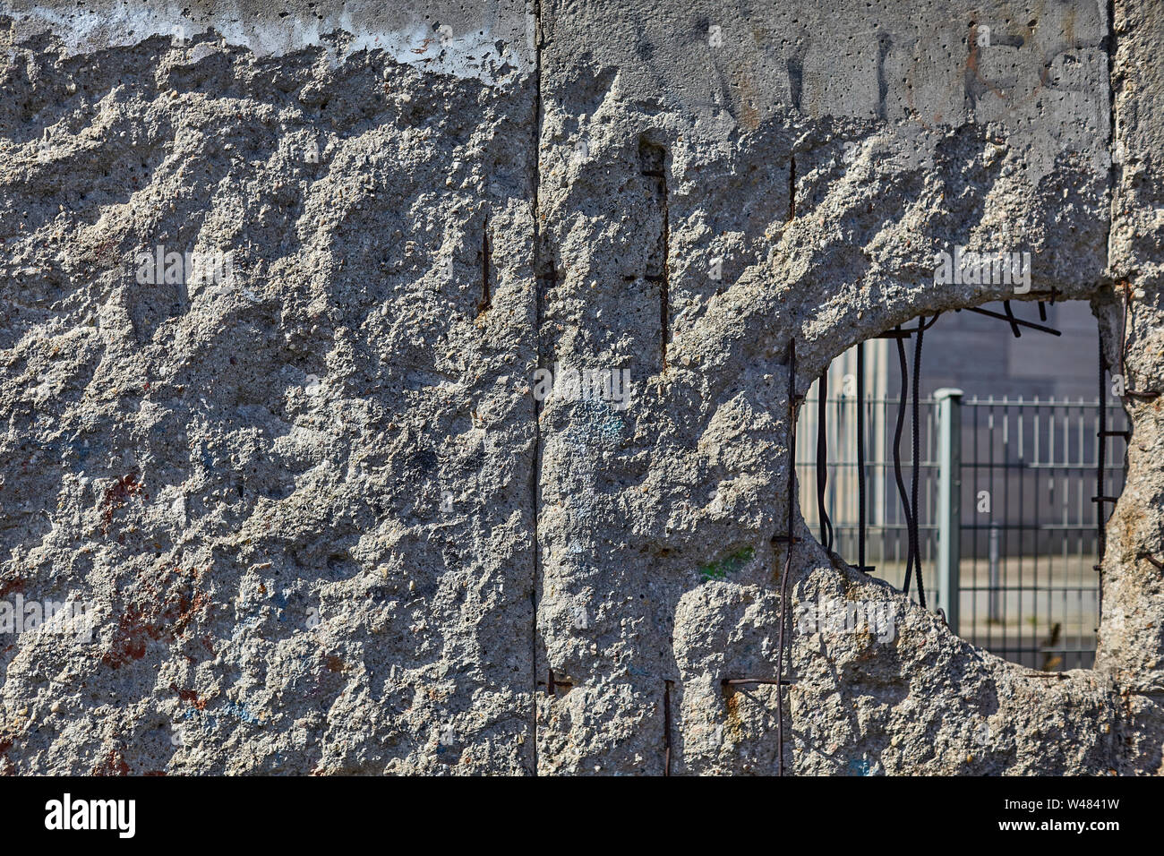 The Berlin Wall was a guarded concrete barrier that physically and 