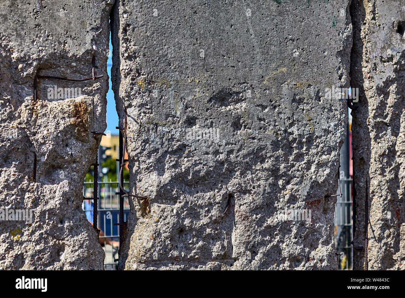 The Berlin Wall was a guarded concrete barrier that physically and ideologically divided Berlin 