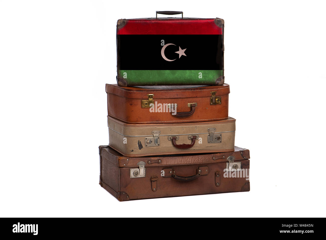 Libya, Libyan travel concept. Group of vintage suitcases isolated on white background Stock Photo