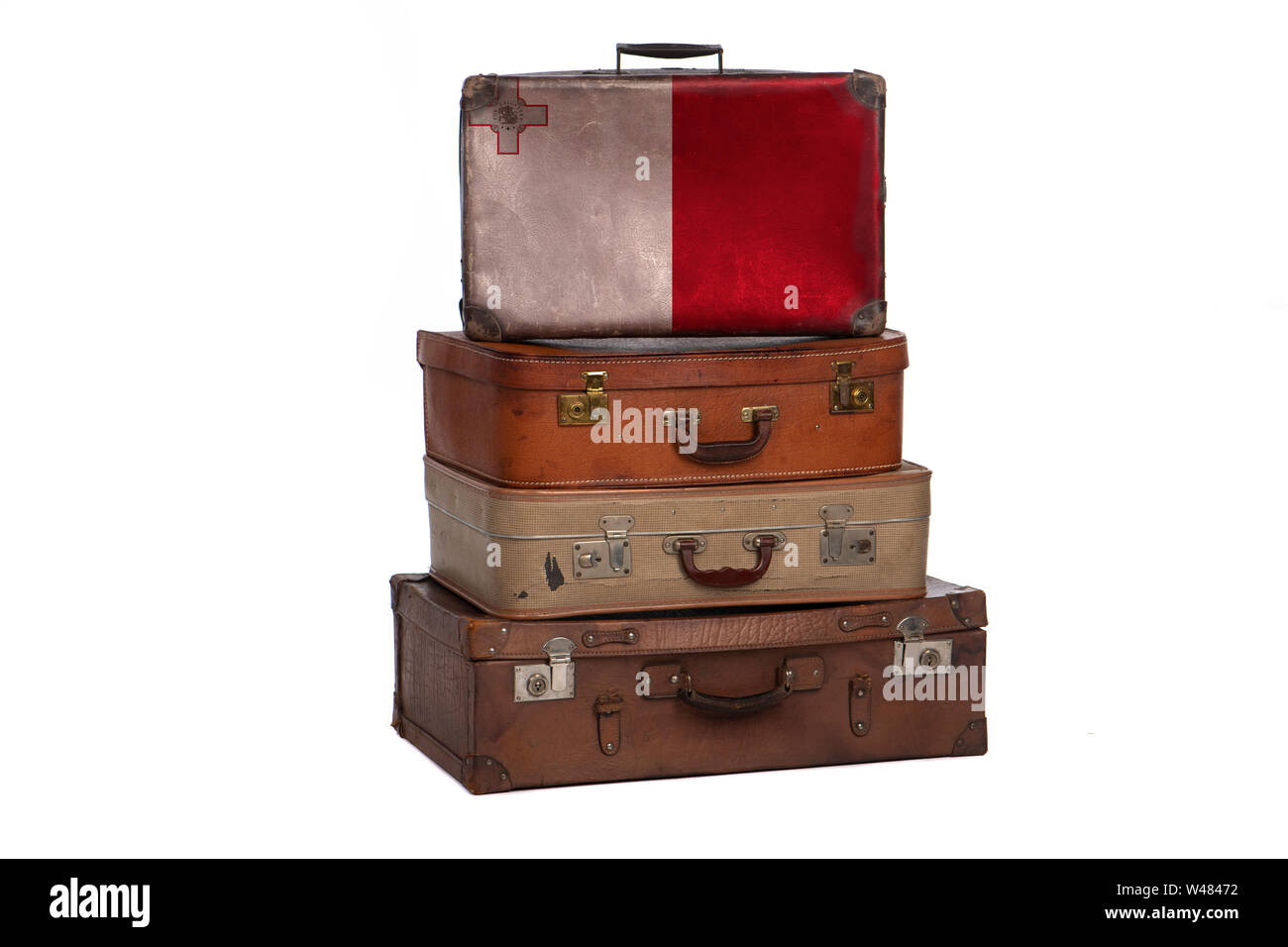 Malta, Maltese travel concept. Group of vintage suitcases isolated on white background Stock Photo