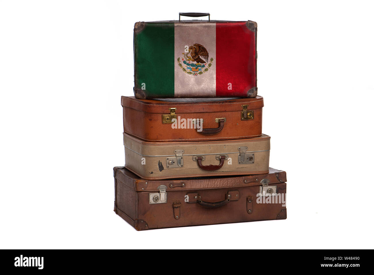 Mexico, Mexican travel concept. Group of vintage suitcases isolated on white background Stock Photo