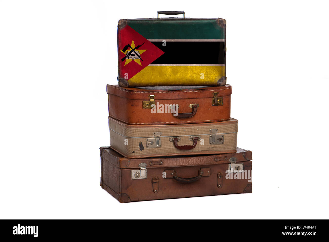 Mozambique, Mozambican travel concept. Group of vintage suitcases isolated on white background Stock Photo