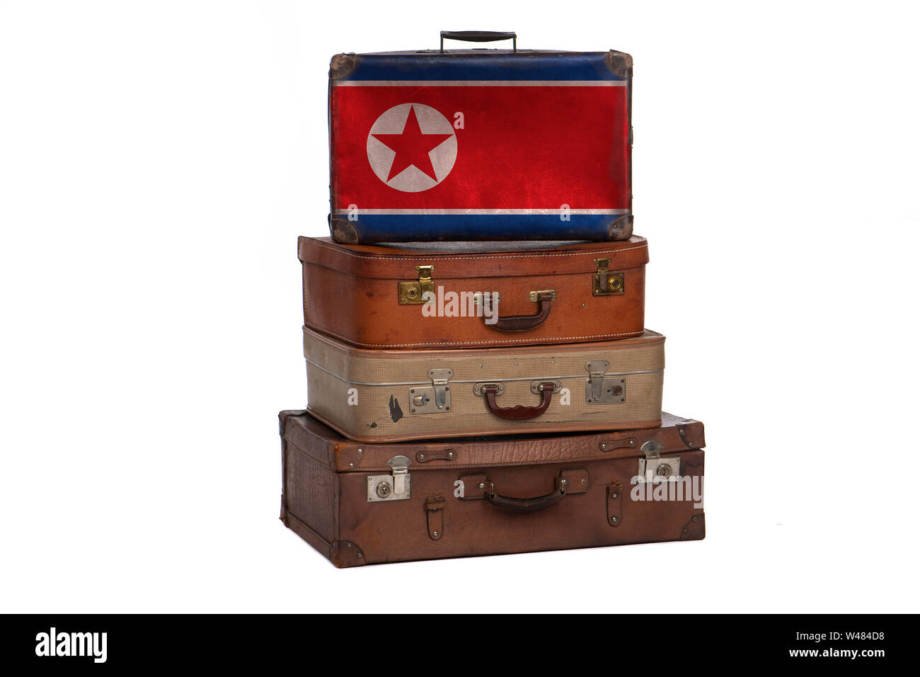 North Korea, Korean travel concept. Group of vintage suitcases isolated