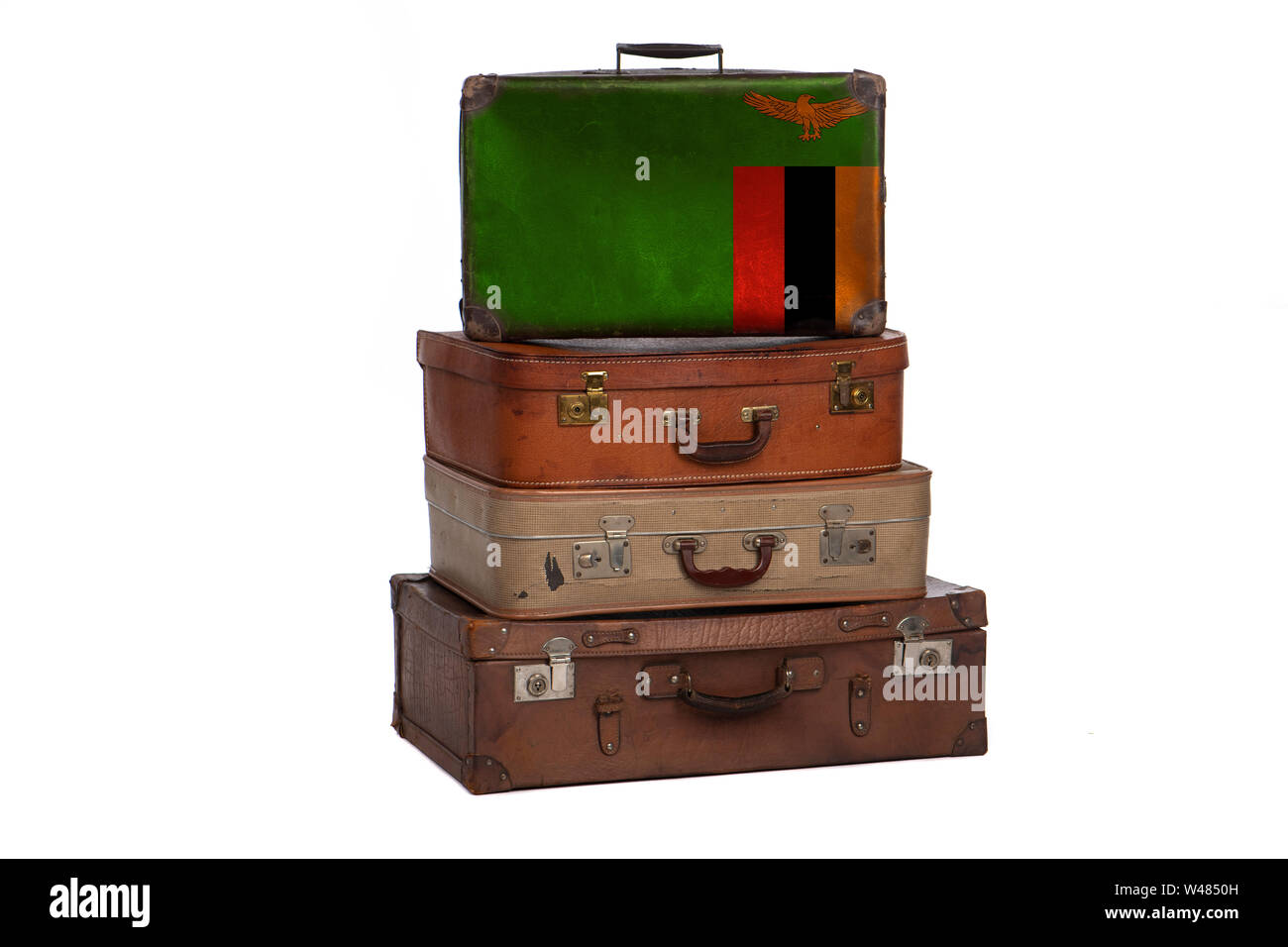 Zambia, Zambian travel concept. Group of vintage suitcases isolated on white background Stock Photo