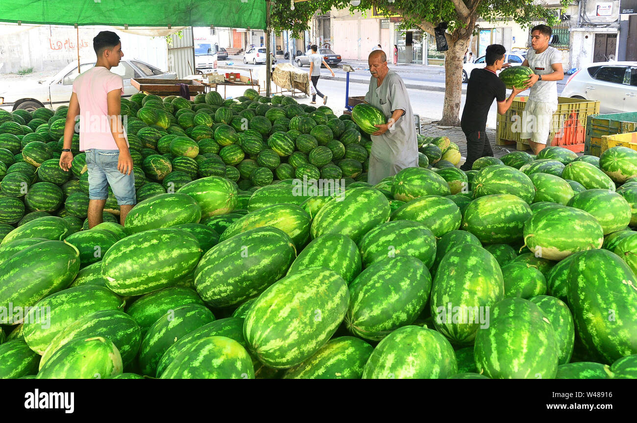 (190721) -- GAZA, July 21, 2019 (Xinhua) -- Palestinian vendors sell watermelons in Gaza City, July 20, 2019. (Str/Xinhua) Stock Photo