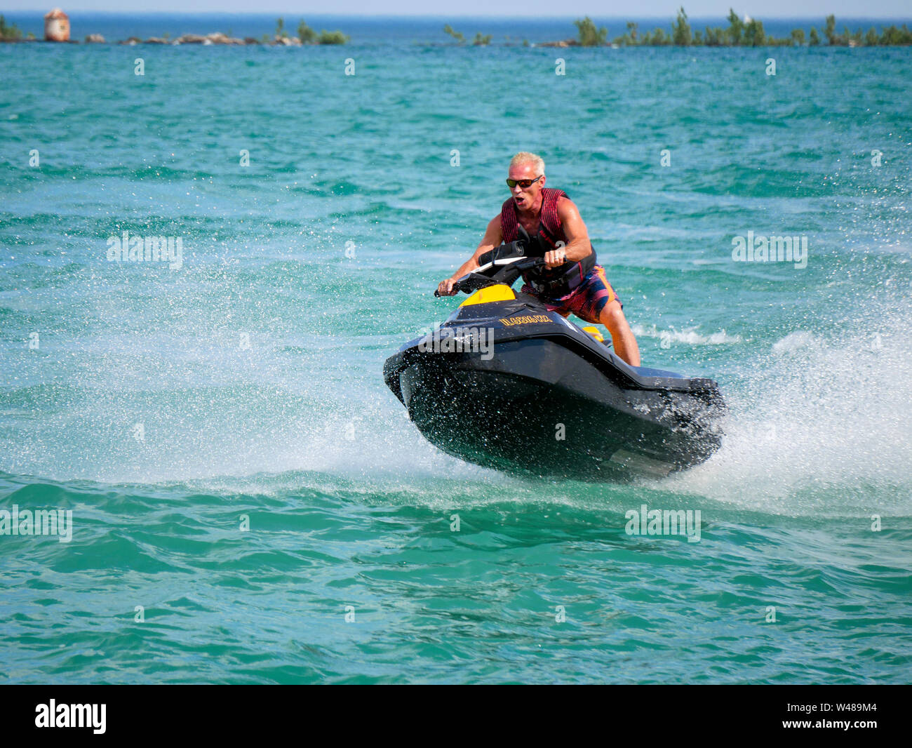 Man riding personal watercraft view from Navy Pier, Chicago, Illinois. Stock Photo