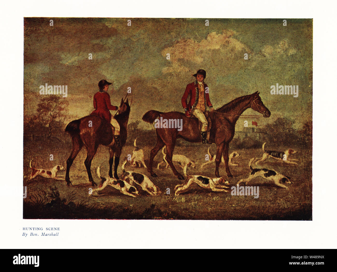 Hunting scene. Two mounted hunters in scarlet jackets with hounds, Regency Era. Color print after a painting by Benjamin Marshall in Ralph Nevill’s Old Sporting Prints, The Connoisseur Magazine, London, 1908. Stock Photo