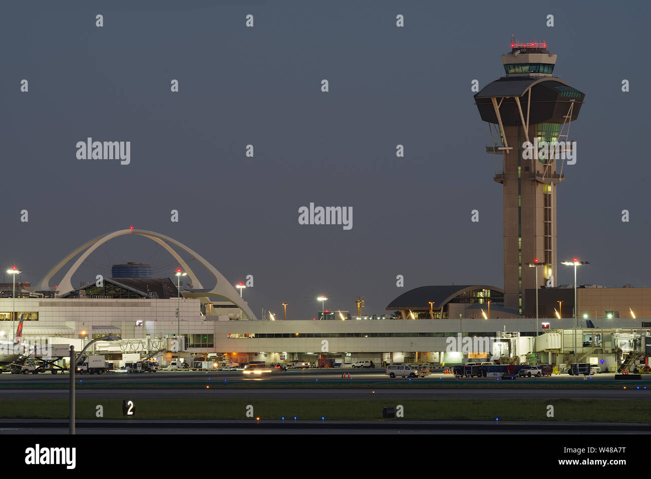 Image showing the landmark Theme Building and the control tower at the Los Angeles Anternational Airport, LAX.. Stock Photo