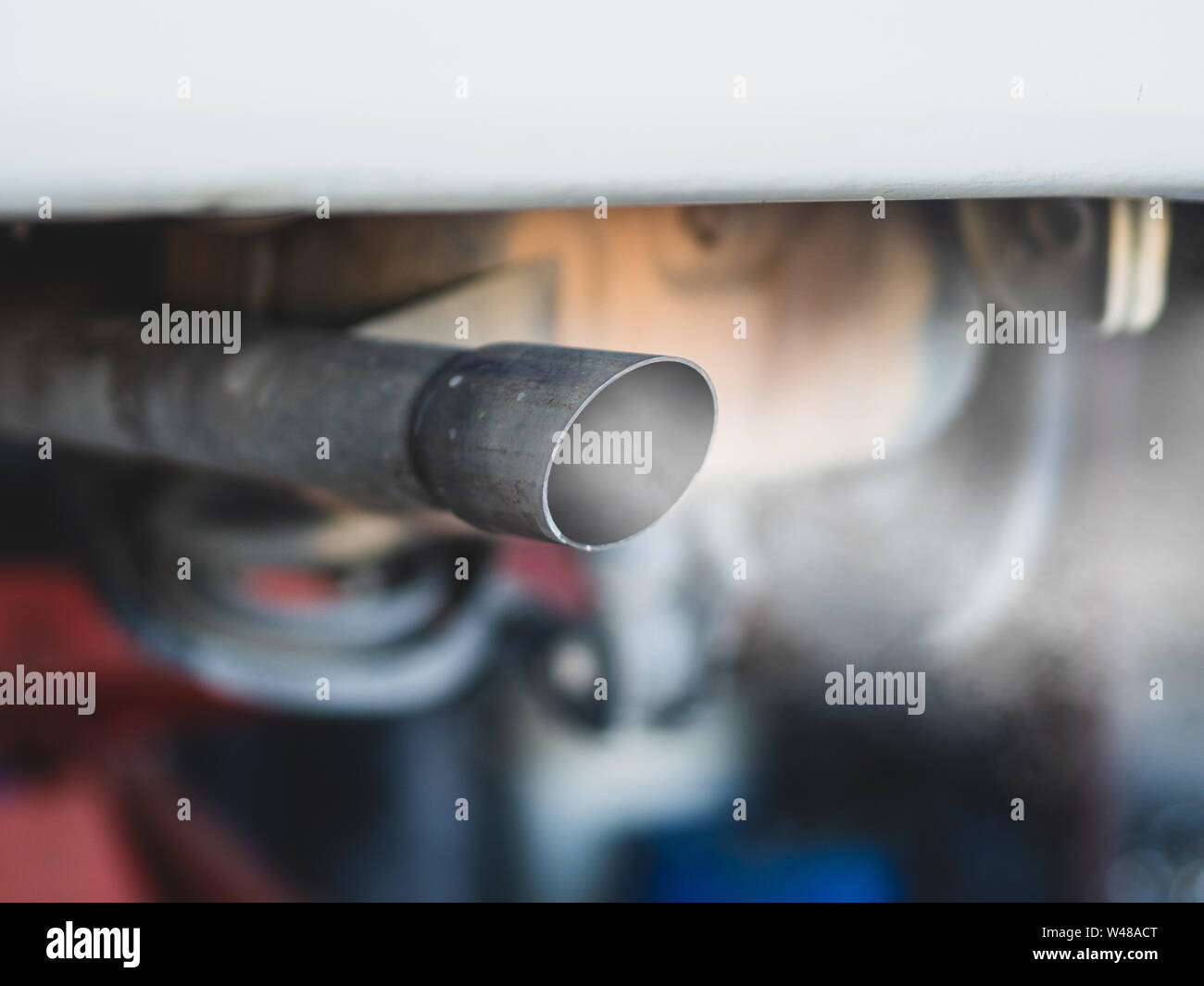 combustion fumes coming out of car exhaust pipe Stock Photo Alamy