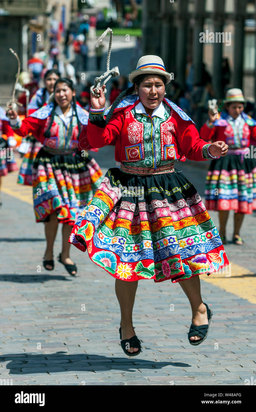 Ladies dressed in colourful Peruvian costume perform at Plaza de Armas at  Cusco in Peru during the May Day parade Stock Photo - Alamy