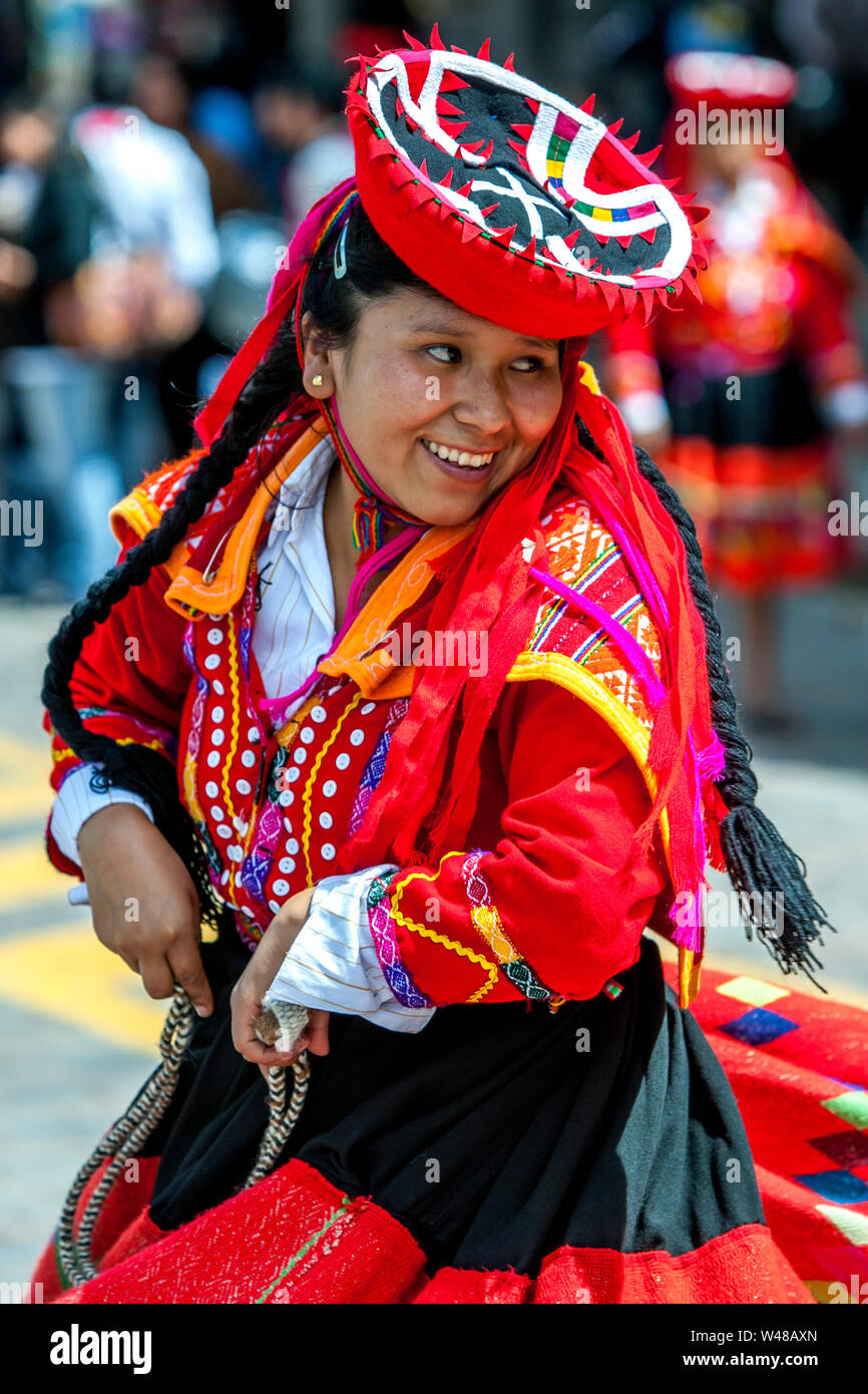 A smiling lady dressed in colourful Peruvian costume performs at Plaza de  Armas at Cusco in Peru during the May Day parade Stock Photo - Alamy