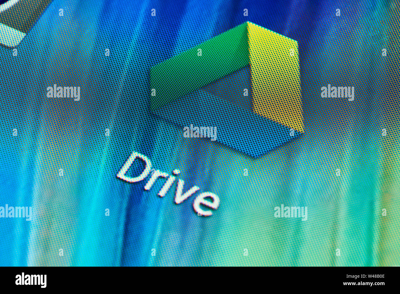 BUENOS AIRES, ARGENTINA - JULY 19, 2019: Google Drive application icon on mobile phone touch screen (Android device). Macro shot. Stock Photo