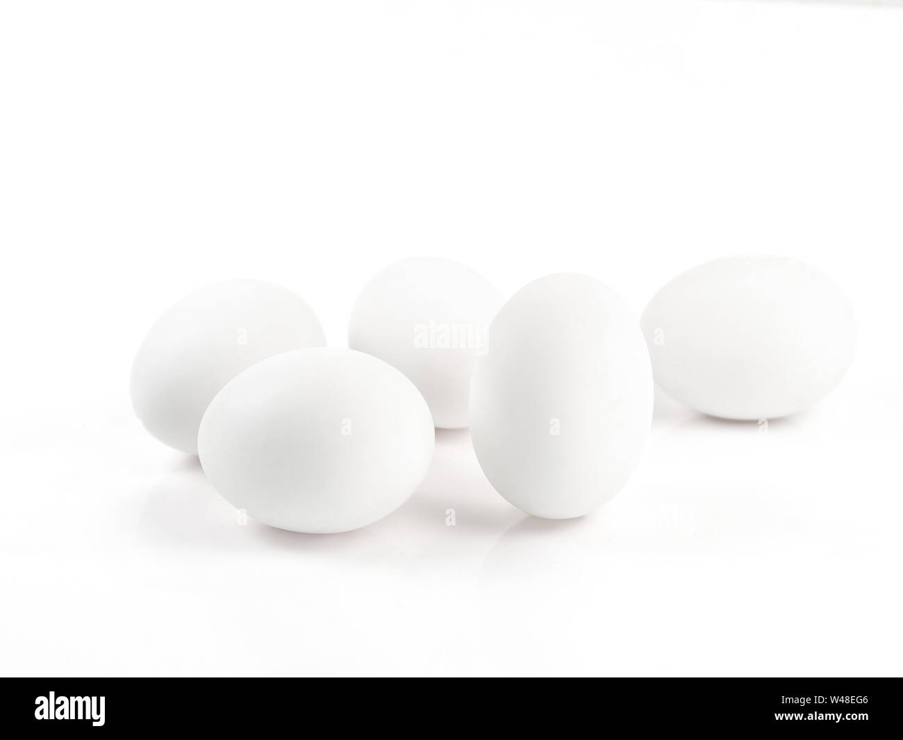 Duck eggs on a white background, white eggs Stock Photo