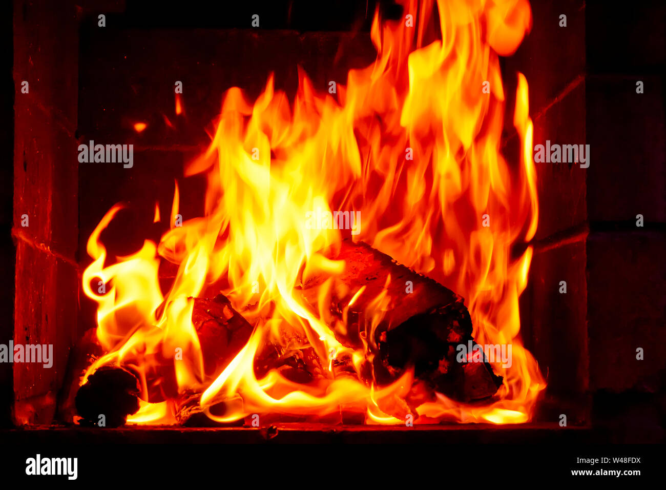 Wallpaper with a bright fire inside the brazier. Flame of fire ...