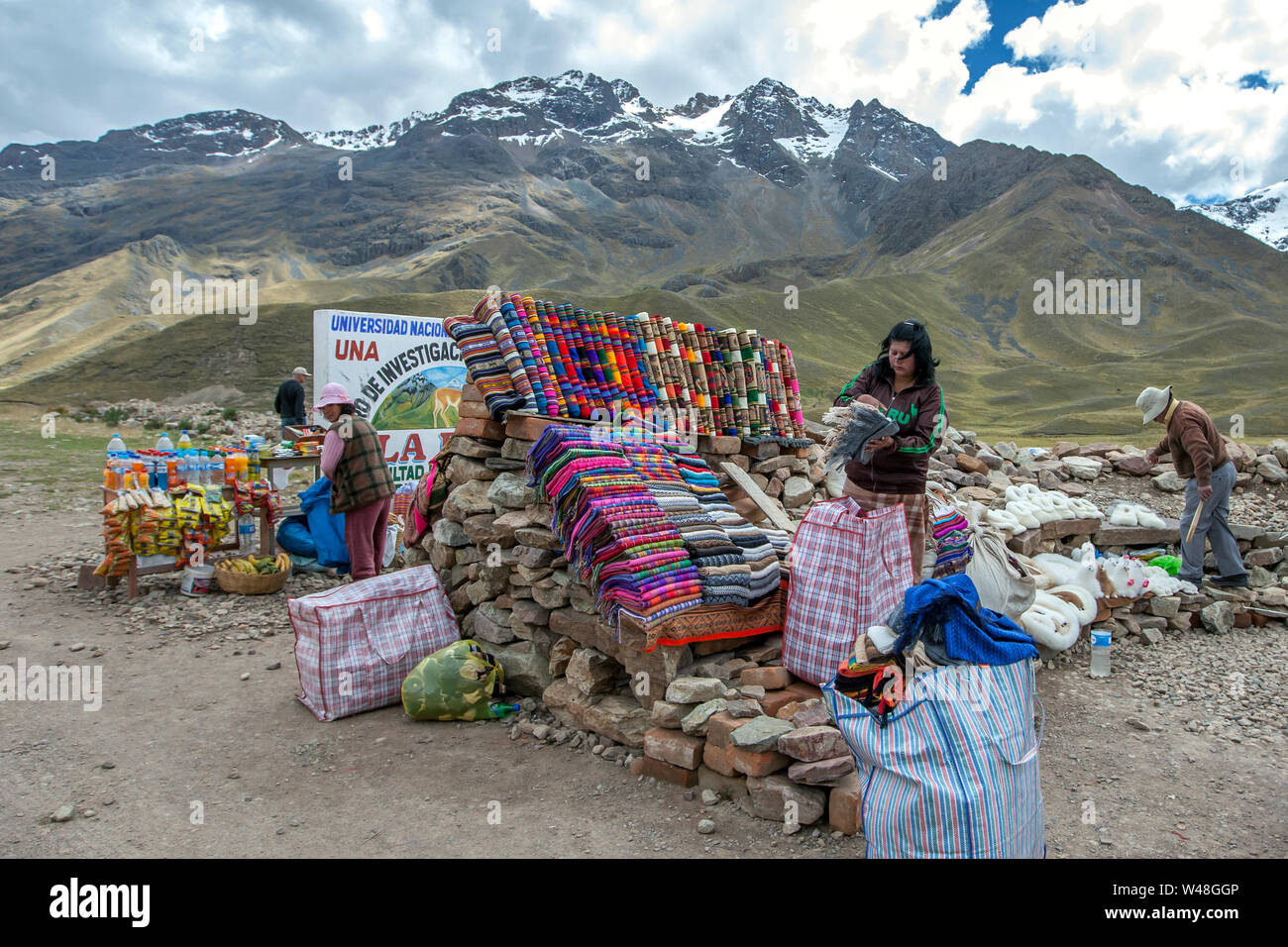 A souvenir and textile stall set up at La Region Puno Les Desea Feliz Viaje in Peru. This location lies at a height of 4335 metres above sea level. Stock Photo