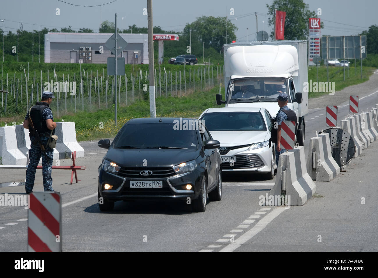 Cars passing through a police checkpoint on the Caucasus Highway (Kavkazskiy Magistral) from North Ossetia-Alania into the Republic of Ingushetia in the North Caucasian Federal District of Russia Stock Photo