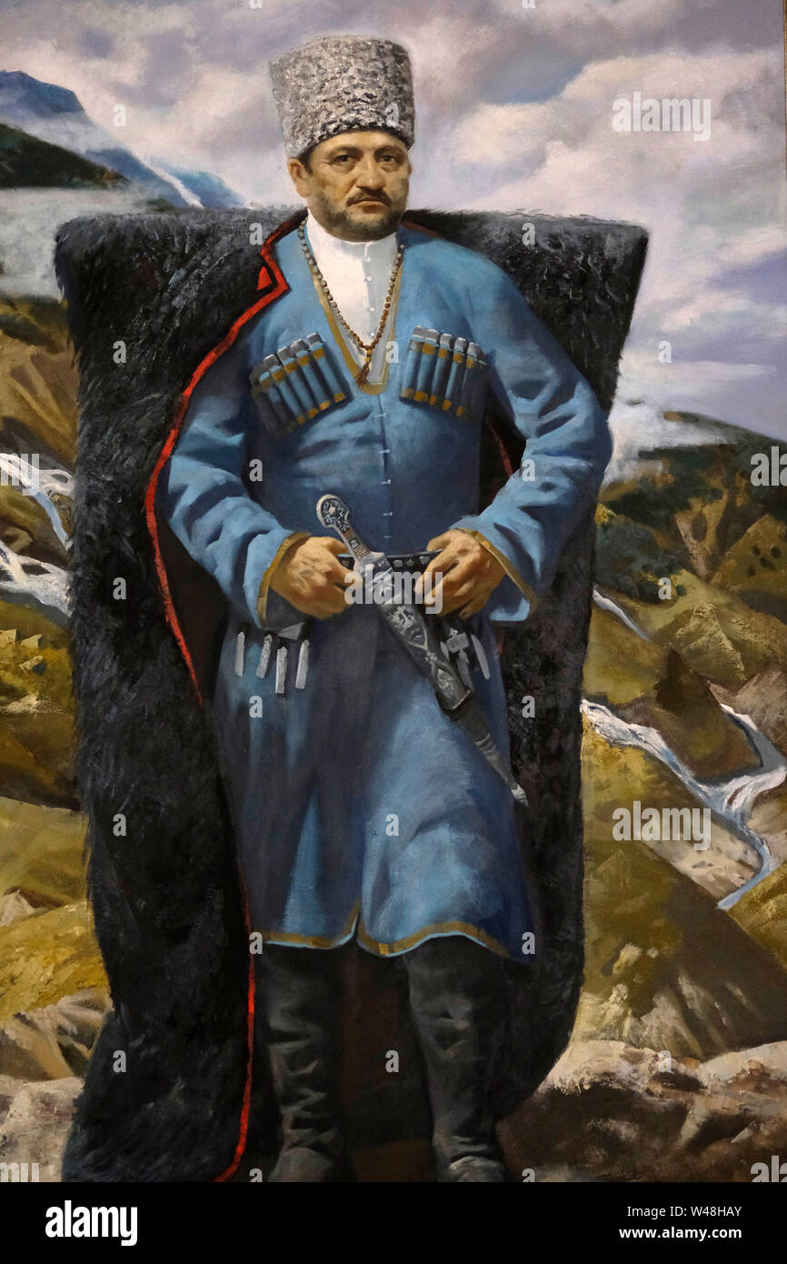 An oil painting bearing the image of  Akhmad Kadyrov former Head of the Chechen Republic in tribal clothes with an intimidating glare displayed at Akhmat Kadyrov museum overwhelmingly a shrine to Akhmat and Ramzan Kadyrov in Grozny the capital city of Chechnya in the North Caucasian Federal District of Russia. Stock Photo