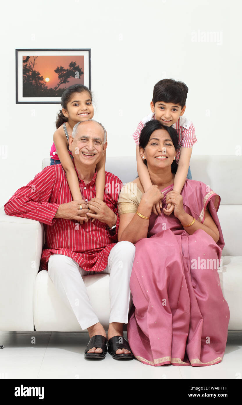 Indian old couple playing with their grandkids Stock Photo
