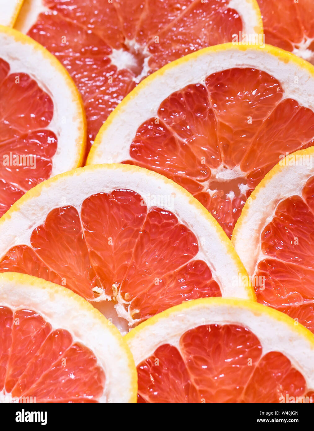 Close up of sliced grapefruit as a background Stock Photo - Alamy
