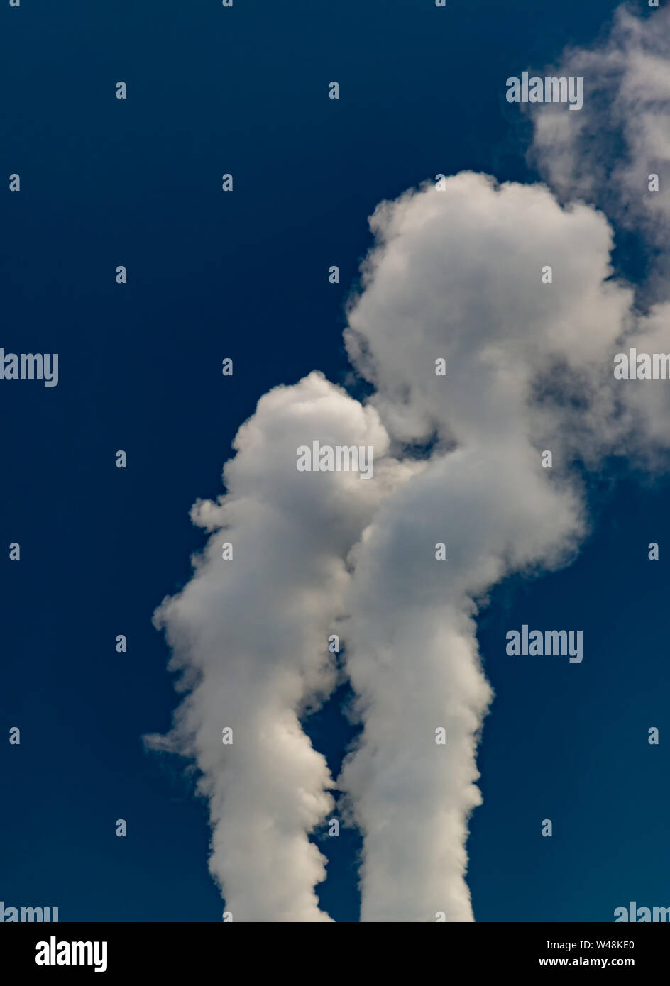 Smoke from pipes of thermal power plant on sunset Stock Photo - Alamy