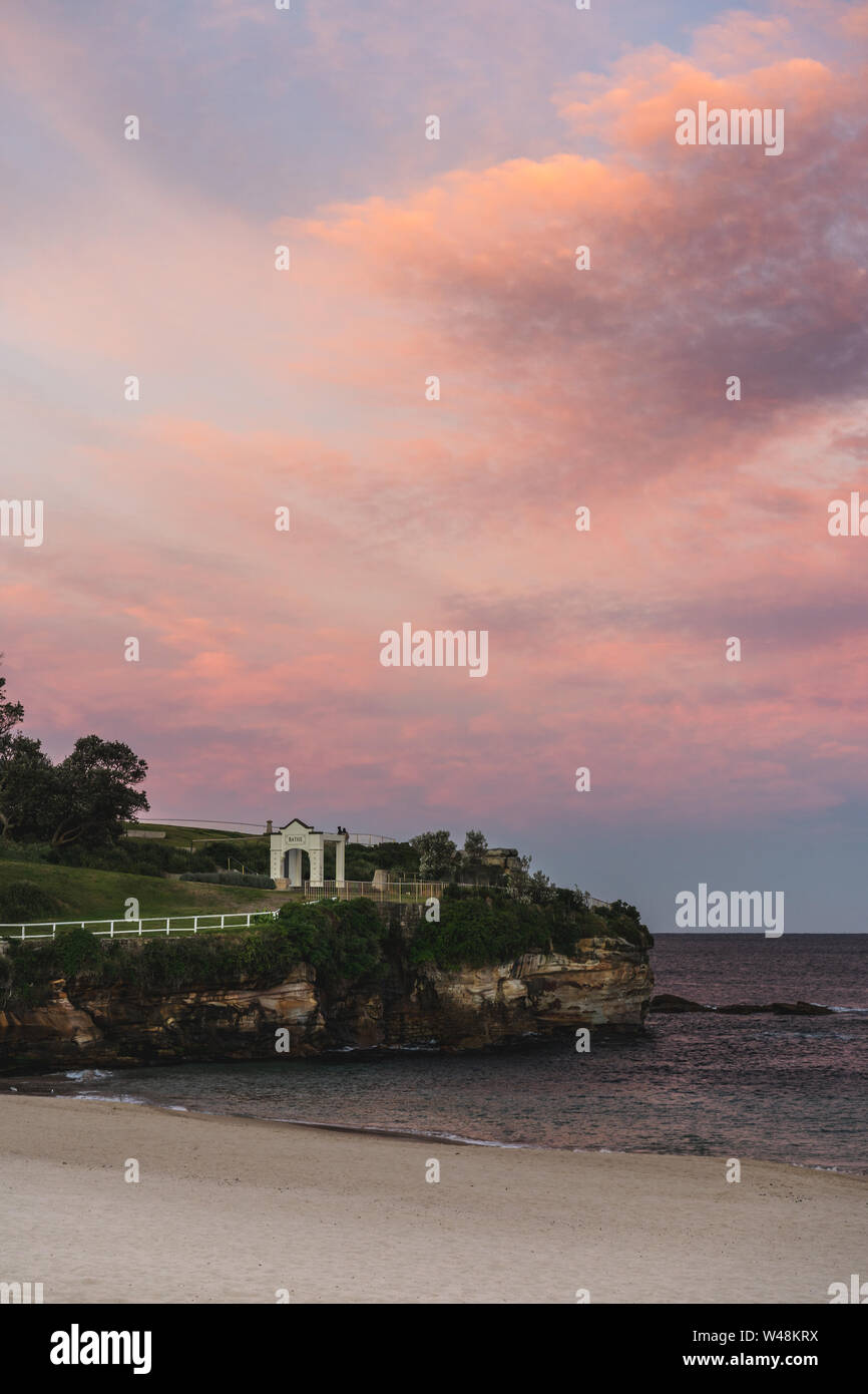 Coogee, New South Wales - JULY 14th, 2019: Sunset lights up the sky over Giles Baths at Coogee Beach, Sydney NSW. Stock Photo