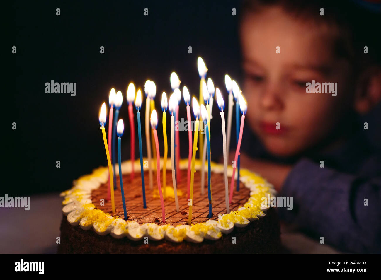 Birthday. A little boy blows out candles on the stoke Stock Photo Alamy